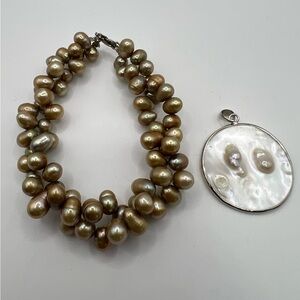 Multi strand pearl bracelet and pearl pendant